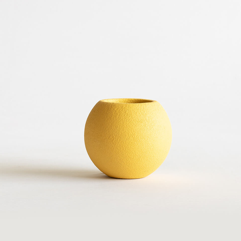 yellow coloured circular fiberglass planter